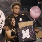 Homecoming Kings and Queen Jassni Morales and Jayden Bray Williams express surprise when picked as the school's top royalty during halftime of Lemoore's football game Friday night.